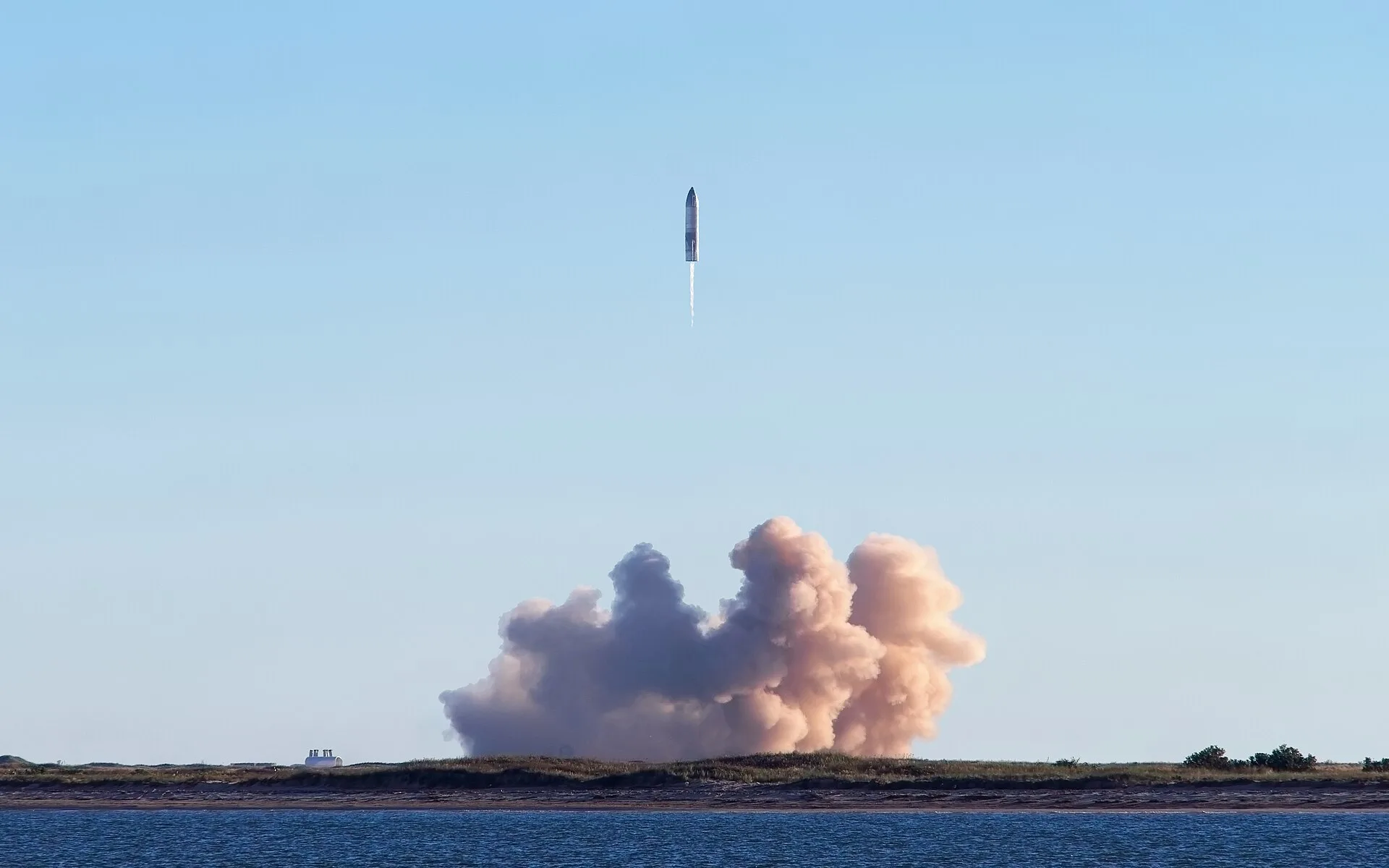 SpaceX Starship Flight 13 rocket launching from Starbase Texas at dusk