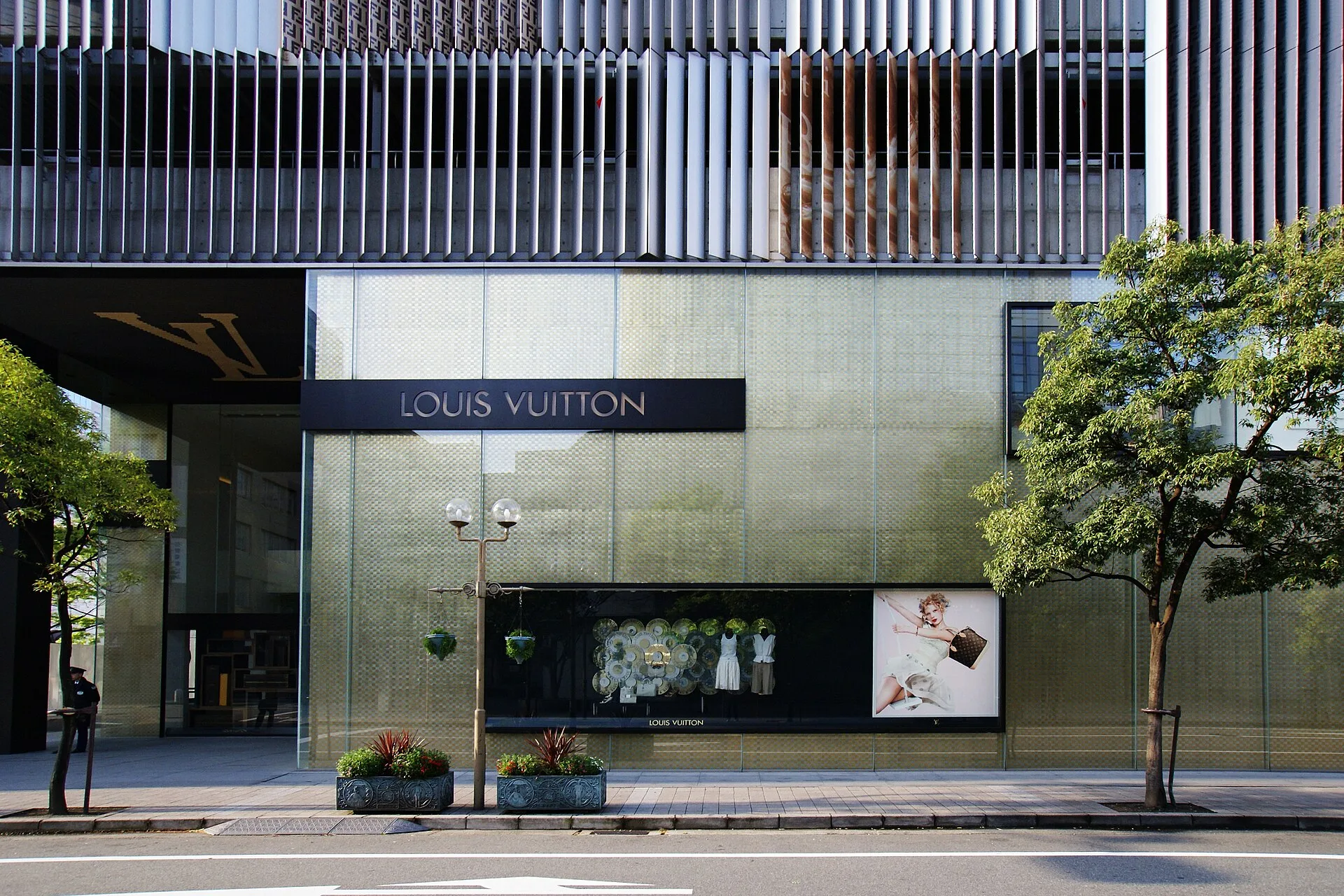 Shoppers browsing luxury leather goods as LVMH fashion growth is constrained by Iran war