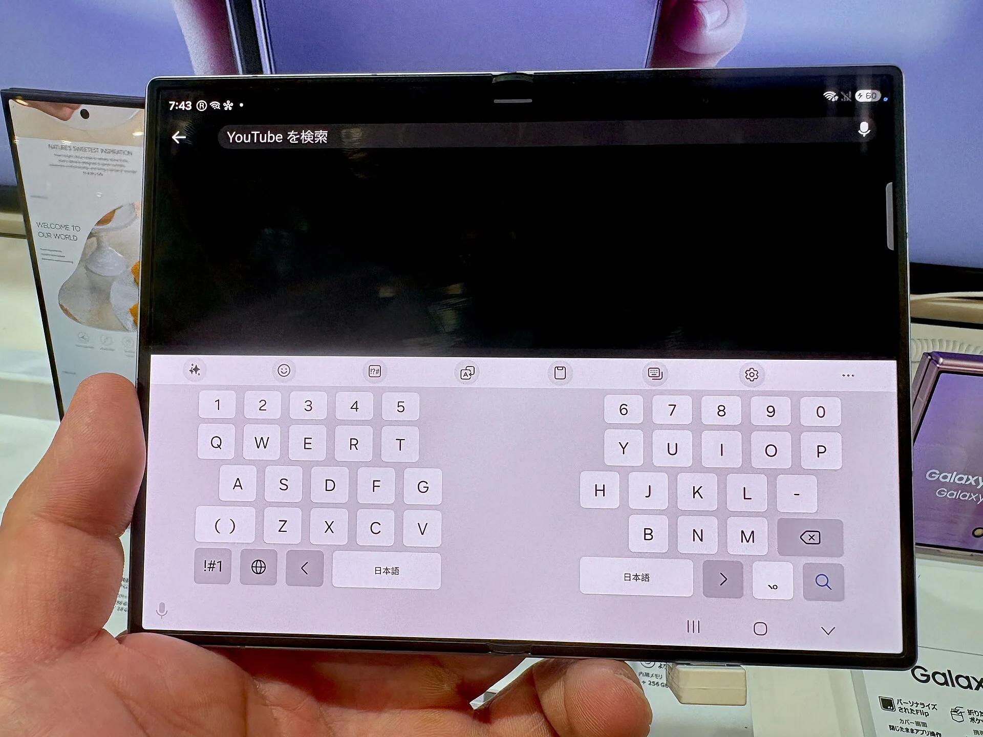 Galaxy Z Fold 8 style foldable phone in tent mode streaming video on outer display